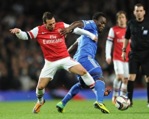 Arsenal V Chelsea - Capital One Cup 4th Rd 2013-14 Prints: Clash of Midfield Giants: Cazorla vs Essien (Arsenal v Chelsea, Capital One Cup 2013-14)