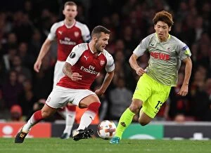 Arsenal v FC Köln 2017-18 Collection: Clash of the Midfield: Jack Wilshere vs. Yuya Osako - Arsenal's Europa League Showdown