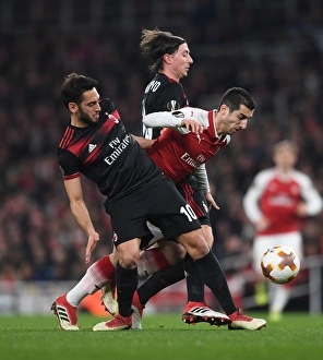 Arsenal V AC Milan 2017-18 Prints: Clash of Midfield Maestros: Mkhitaryan vs Calhanoglu & Montolivo in Arsenal vs AC Milan Europa League Showdown
