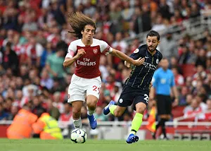 Arsenal V Manchester City 2018-19 Prints: Clash of Midfield Maestros: Guendouzi vs. Silva - Arsenal v Manchester City (2018-19)