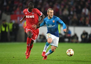 FC Koln V Arsenal 2017-18 Prints: Clash of Midfield Maestros: Jack Wilshere vs
