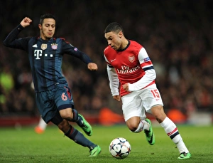 Arsenal V Bayern Munich 2013-14 Prints: Clash of the Midfield Maestros: Oxlade-Chamberlain vs
