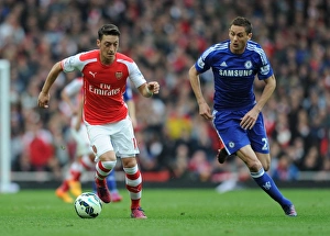 Arsenal V Chelsea 2014/15 Prints: Clash of Midfield Maestros: Ozil vs. Matic - Arsenal vs. Chelsea, Premier League Showdown