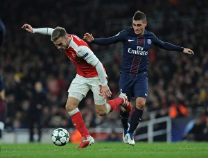 Arsenal V Paris Saint-Germain 2016-17 Prints: Clash of Midfield Maestros: Ramsey vs