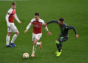 Arsenal V Sporting Clube De Portugal 2018-19 Prints: Clash of Midfield Maestros: Ramsey vs. Gudelj in Arsenal's Europa League Battle
