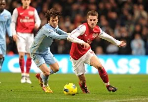 Images Dated 18th December 2011: Clash of the Midfield Maestros: Ramsey vs Silva, Manchester City vs Arsenal, Premier League 2011-12