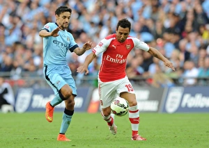 Arsenal V Manchester City - FA Community Shield 2014/15 Prints: Clash of Midfield Maestros: Santi Cazorla vs