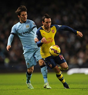 Manchester City V Arsenal 2014-15 Prints: Clash of Midfield Maestros: Santi Cazorla vs