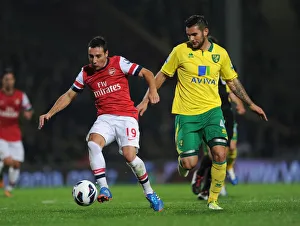 Norwich City V Arsenal 2012-13 Prints: Clash of Midfield Maestros: Santi Cazorla vs