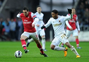 Swansea City V Arsenal 2012-13 Prints: Clash of Midfield Maestros: Santi Cazorla vs