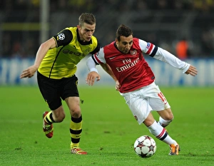 Borussia Dortmund V Arsenal 2013-14 Prints: Clash of Midfield Maestros: Santi Cazorla vs