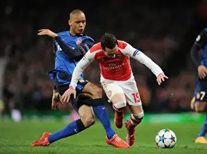 Arsenal V Monaco 2104/15 Prints: Clash of Midfield Maestros: Santi Cazorla vs Fabinho in Arsenal's UEFA Champions League Battle against AS Monaco