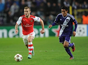 Anderlecht V Arsenal 2014-15 Prints: Clash of Midfield Talents: Jack Wilshere vs