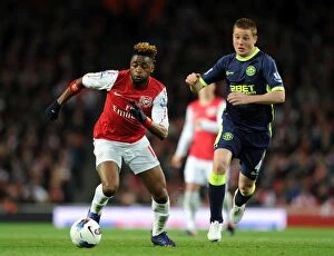 Images Dated 16th April 2012: Clash of Midfield Titans: Alex Song vs. James McCarthy (Arsenal vs. Wigan Athletic, 2011-12)