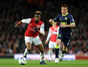 Arsenal V Wigan Athletic 2011-12 Prints: Clash of Midfield Titans: Alex Song vs