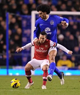 Images Dated 28th November 2012: Clash of Midfield Titans: Cazorla vs. Fellaini (Everton vs. Arsenal, 2012-13)