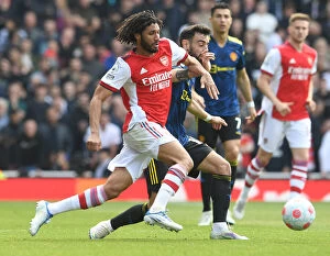 Images Dated 23rd April 2022: Clash of the Midfield Titans: Elneny vs Fernandes - Arsenal vs Manchester United