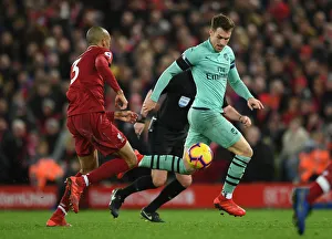 Clash of the Midfield Titans: Fabinho vs. Ramsey - Premier League Showdown