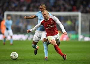 Images Dated 25th February 2018: Clash of Midfield Titans: Jack Wilshere vs Fernandinho - Arsenal vs Manchester City Carabao Cup