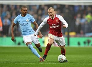 Images Dated 25th February 2018: Clash of Midfield Titans: Jack Wilshere vs Fernandinho - Arsenal vs Manchester City Carabao Cup