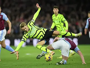 Clash of Midfield Titans: Odegaard vs McGinn in Aston Villa vs Arsenal FC (2023-24)