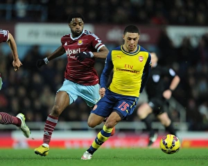 West Ham United V Arsenal 2014-15 Prints: Clash of Midfield Titans: Oxlade-Chamberlain vs. Song (Arsenal vs. West Ham, 2014-15)