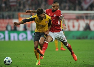 Bayern Munich V Arsenal 2016-17 Prints: Clash of the Midfield Titans: Oxlade-Chamberlain vs