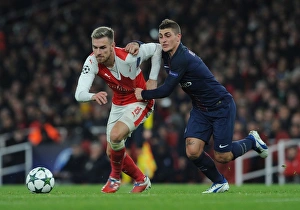 Arsenal V Paris Saint-Germain 2016-17 Prints: Clash of the Midfield Titans: Ramsey vs