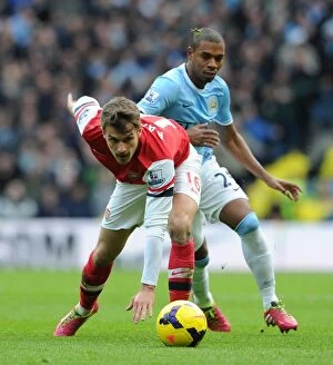Manchester City v Arsenal 2013-14 Collection: Clash of Midfield Titans: Ramsey vs. Fernandinho, Premier League Showdown, Manchester City vs