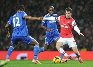 Images Dated 23rd December 2013: Clash of Midfield Titans: Ramsey vs. Mikel (Arsenal vs. Chelsea, 2013-14)