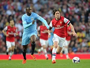 Images Dated 29th March 2014: Clash of Midfield Titans: Rosicky vs Yaya Toure (Arsenal vs Manchester City, 2013/14)