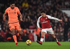 Arsenal v Liverpool 2017-18 Collection: Clash of Midfield Titans: Sanchez vs Can - Arsenal vs Liverpool, Premier League 2017-18