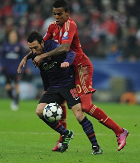 Bayern Munich V Arsenal 2012-13 Prints: Clash of Midfield Titans: Santi Cazorla vs