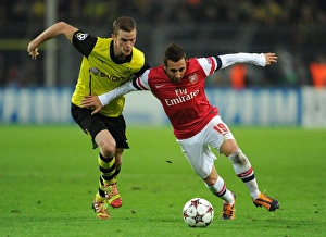 Borussia Dortmund V Arsenal 2013-14 Prints: Clash of Midfield Titans: Santi Cazorla vs