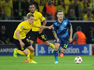 Clash of Midfield Titans: Wilshere vs. Ginter in Borussia Dortmund vs. Arsenal, UEFA Champions League