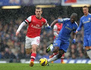 Images Dated 20th January 2013: Clash of Midfield Titans: Wilshere vs. Ramires, Premier League 2012-13