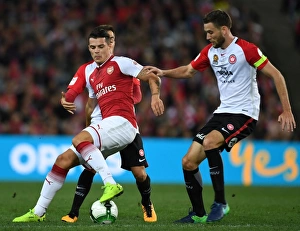 Sydney Western Wanderers V Arsenal 2017-18 Prints: Clash of the Midfield Titans: Xhaka vs. Cornthwaite (Sydney Wanderers vs. Arsenal, 2017)