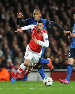 Arsenal V Monaco 2104/15 Prints: Clash of Midfielders: Coquelin vs Fabinho in Arsenal's UEFA Champions League Battle against Monaco