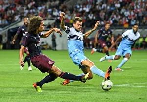 Clash of Midfielders: Guendouzi vs. Acerbi in Arsenal's Pre-Season Battle with Lazio