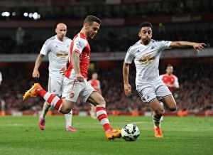 Images Dated 11th May 2015: Clash of Midfielders: Jack Wilshere vs Neil Taylor - Arsenal vs Swansea City, Premier League 2014/15