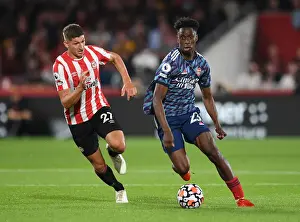 Brentford V Arsenal 2021-22 Prints: Clash of the Midfielders: Lokonga vs Janelt - Brentford vs Arsenal Premier League Showdown