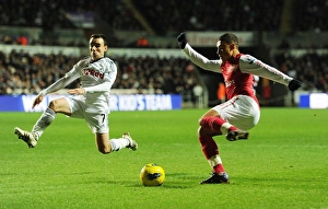 Swansea City V Arsenal 2011-12 Prints: Clash of Midfielders: Oxlade-Chamberlain vs. Britton (Swansea v Arsenal, 2011-12)