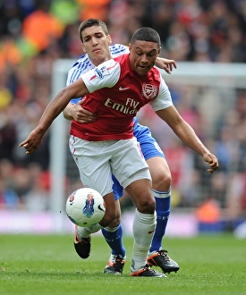 Clash of Midfielders: Oxlade-Chamberlain vs. Romeu in Arsenal v Chelsea Showdown