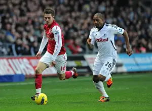 Swansea City V Arsenal 2011-12 Prints: Clash of Midfielders: Ramsey vs. Agustien - Swansea City vs. Arsenal, Premier League, 2012