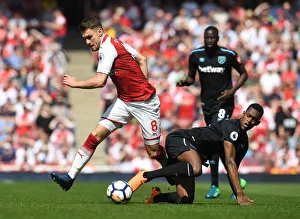 Arsenal V West Ham United 2017-18 Prints: Clash of Midfielders: Ramsey vs. Fernandes, Arsenal vs. West Ham United, Premier League