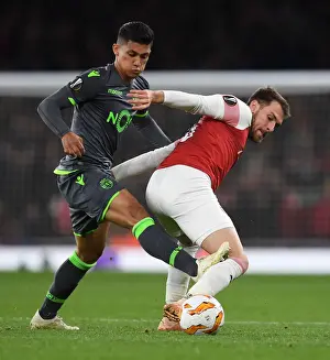 Arsenal V Sporting Clube De Portugal 2018-19 Prints: Clash of Midfielders: Ramsey vs. Montero in Arsenal's Europa League Battle