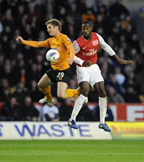 Wolverhampton Wanderers V Arsenal 2011-12 Prints: Clash at Molineux: Djourou vs. Doyle - Wolverhampton Wanderers vs