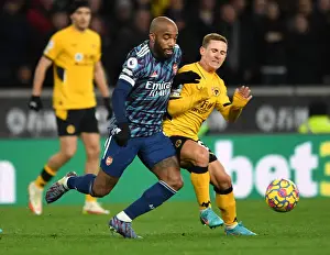 Wolverhampton Wanderers V Arsenal 2021-22 Prints: Clash at Molineux: Lacazette vs