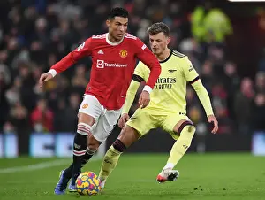 Manchester United V Arsenal 2020-21 Prints: Clash at Old Trafford: Arsenal's Ben White Shuts Down Ronaldo's Manchester United