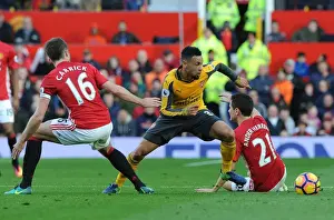 Manchester United V Arsenal 2016-17 Prints: Clash at Old Trafford: Coquelin Stands Firm Against United's Midfield Trio
